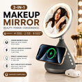 A 3-in-1 wireless makeup mirror, phone stand, and Bluetooth speaker set shown on a light beige surface with promotional text. The product features a round LED-backlit mirror on a gray tripod stand, with a smartphone placed on top showing wireless charging and a white wireless earbud beside it.